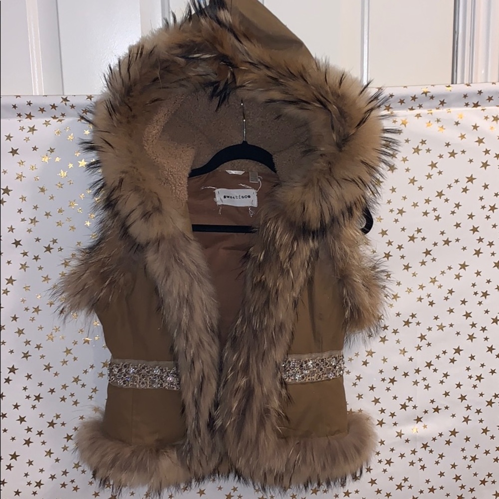 Fur vest with rhinestone detail. Real fur.
